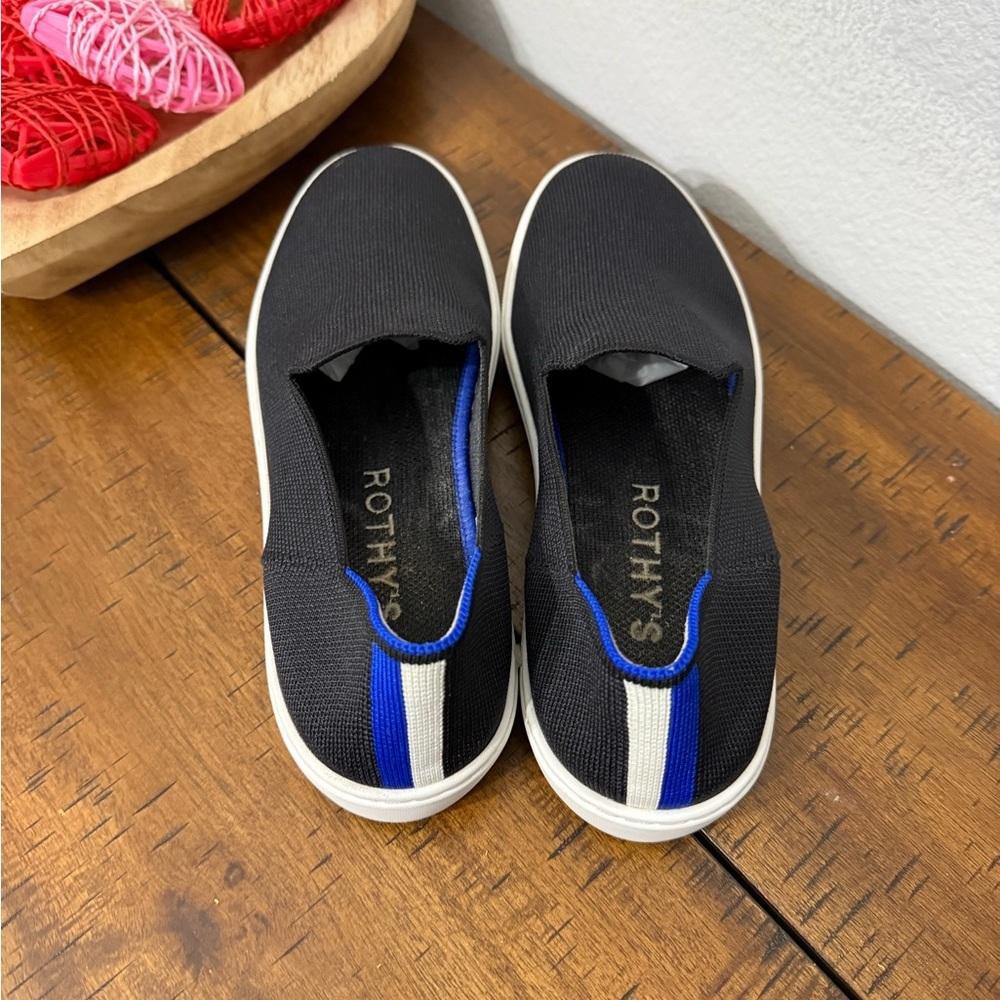 Rothy's The Original Slip On Sneaker in black solid with blue trim - Picture 2 of 8